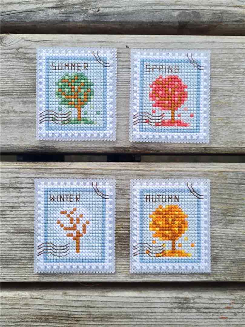 A stitched preview of the counted cross stitch pattern 4 Seasons Postage Stamps by Kate Spiridonova
