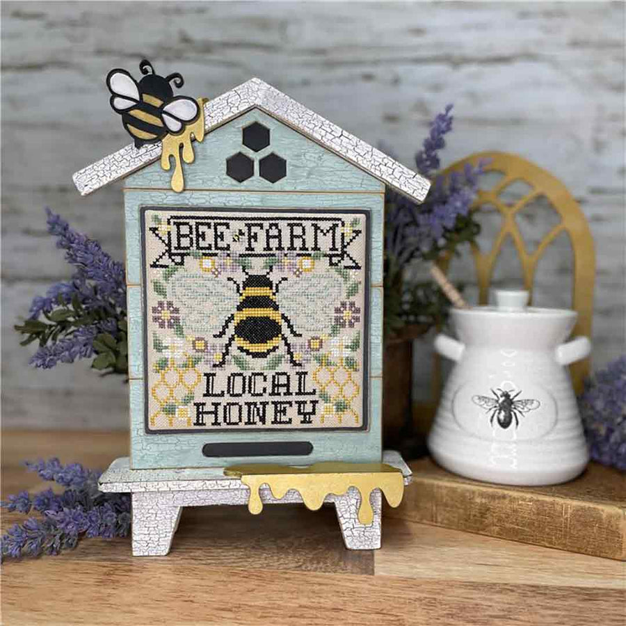 A stitched preview of the counted cross stitch pattern Bee Farm by Erin Elizabeth Designs