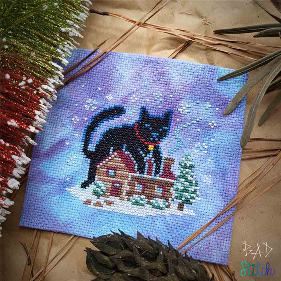 A stitched preview of the counted cross stitch pattern Yule Cat by BAD Stitch