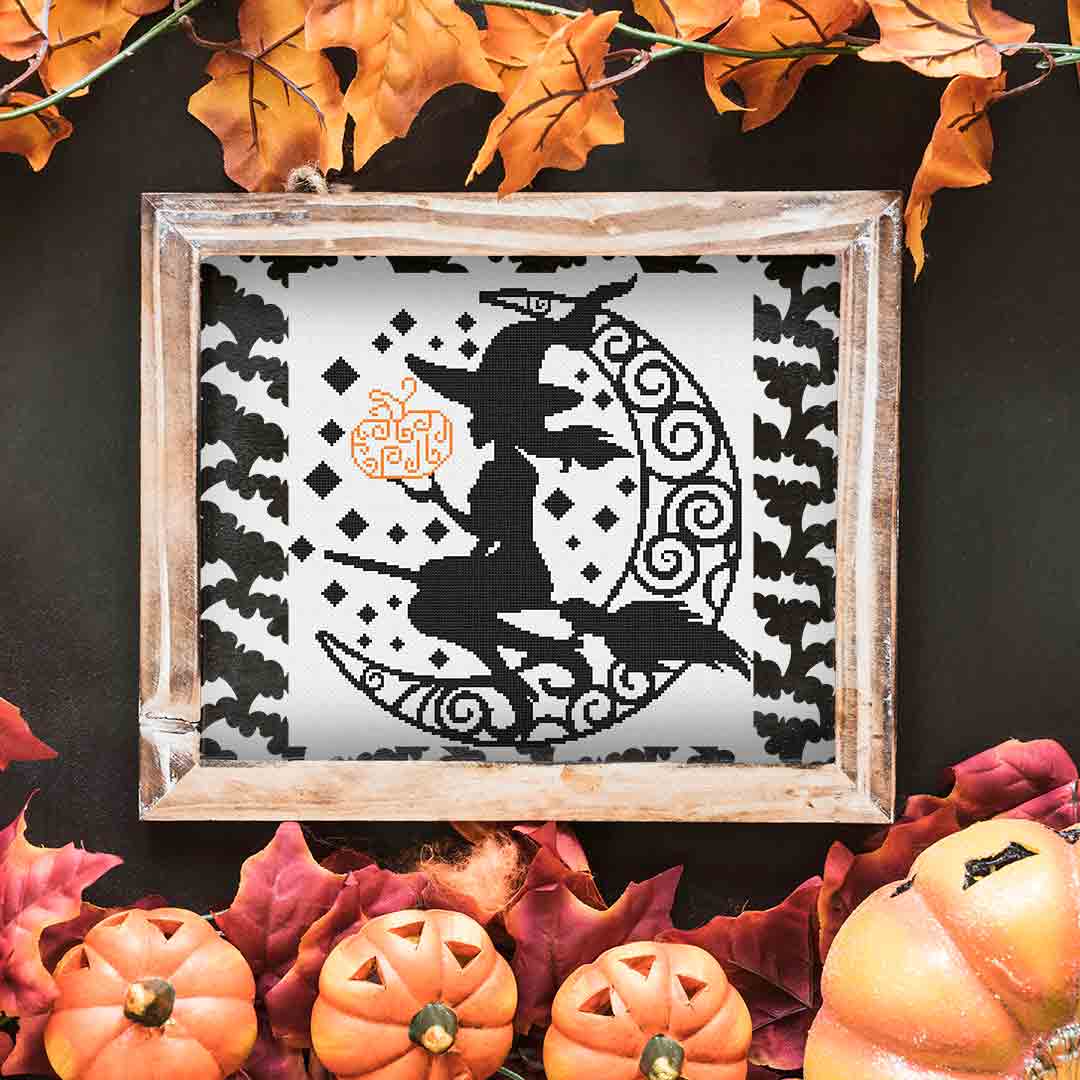 Image of stitched and framed preview of "Witch's Crescent" a counted cross stitch pattern and kit by Stitch Wit