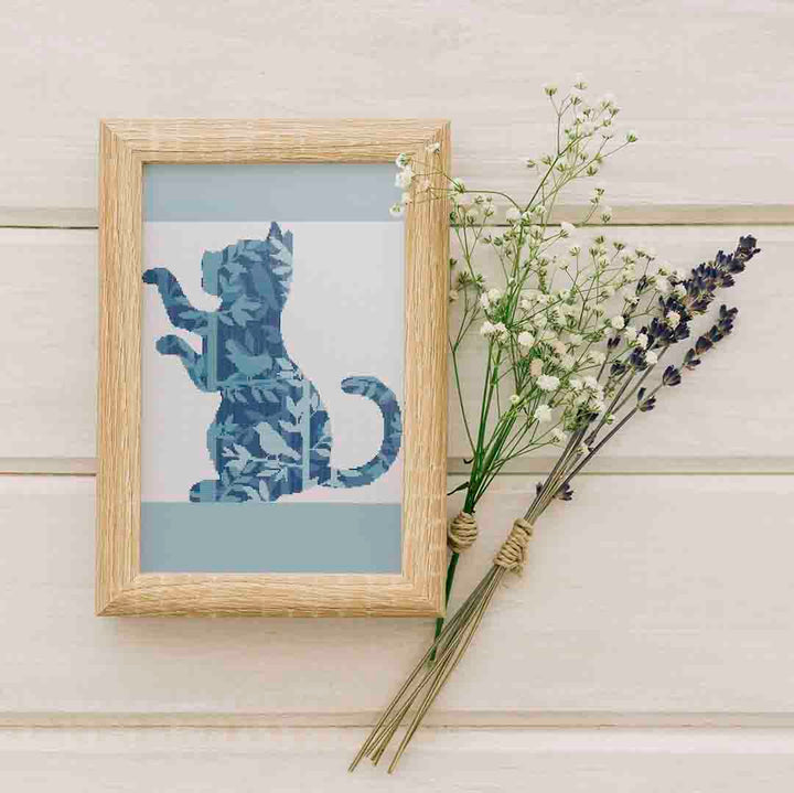 Stitched and framed preview of Birds And A Kitten Counted Cross Stitch Pattern and Kit