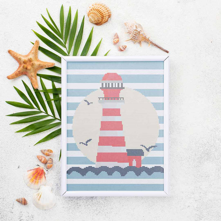 Stitched and framed preview of Lighthouse Counted Cross Stitch Pattern and Kit