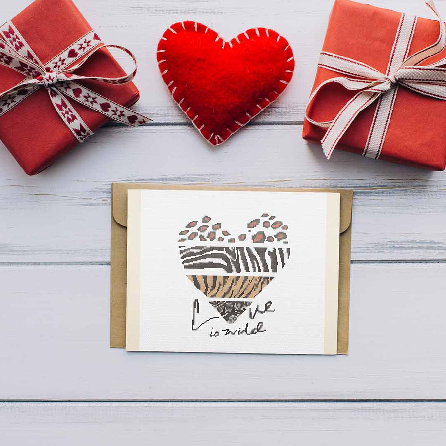 Stitched and framed preview of Love Is Wild Counted Cross Stitch Pattern and Kit