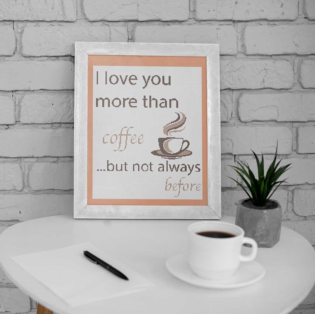 Stitched and framed preview of More Than Coffee Counted Cross Stitch Pattern and Kit
