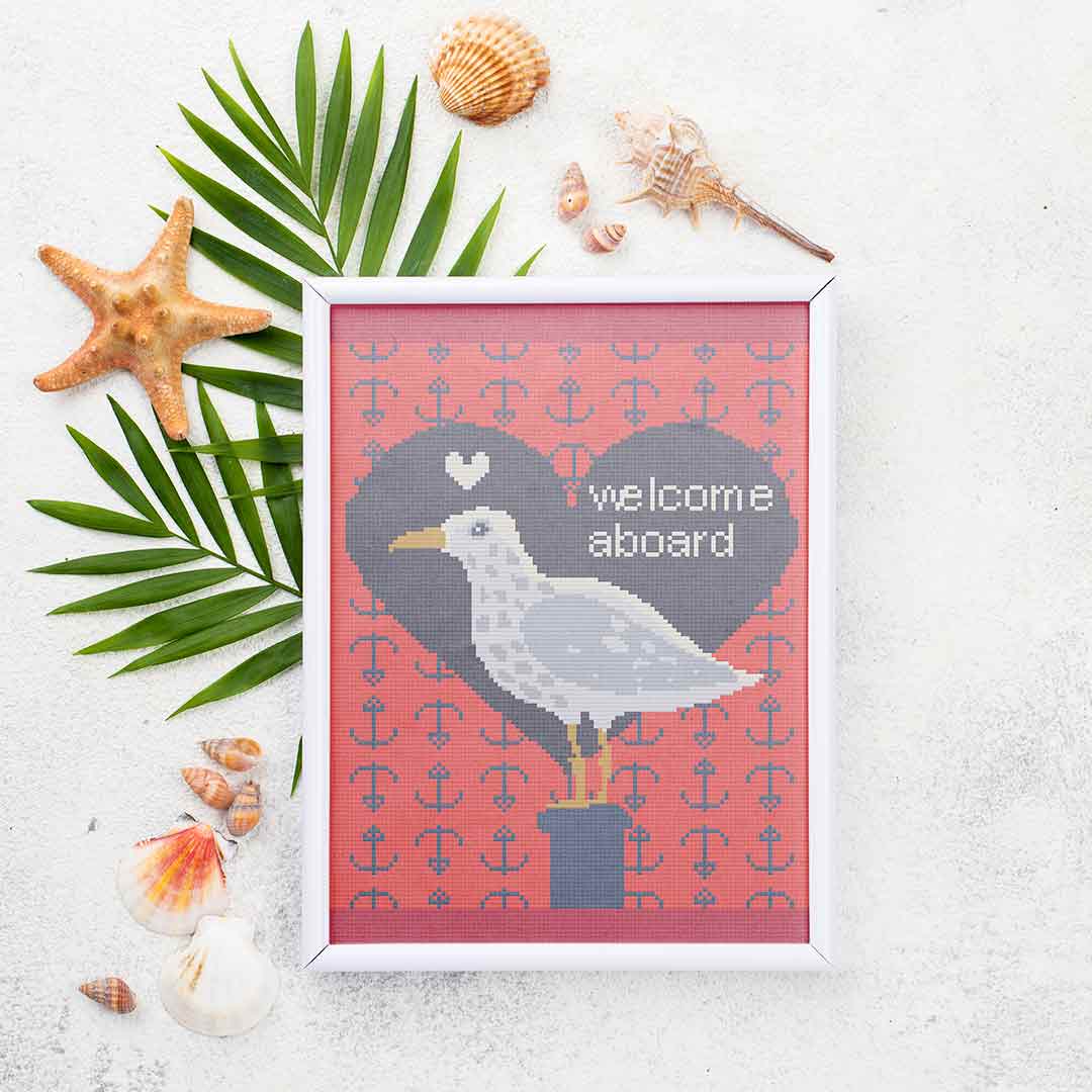 Stitched and framed preview of Welcome Aboard Counted Cross Stitch Pattern and Kit