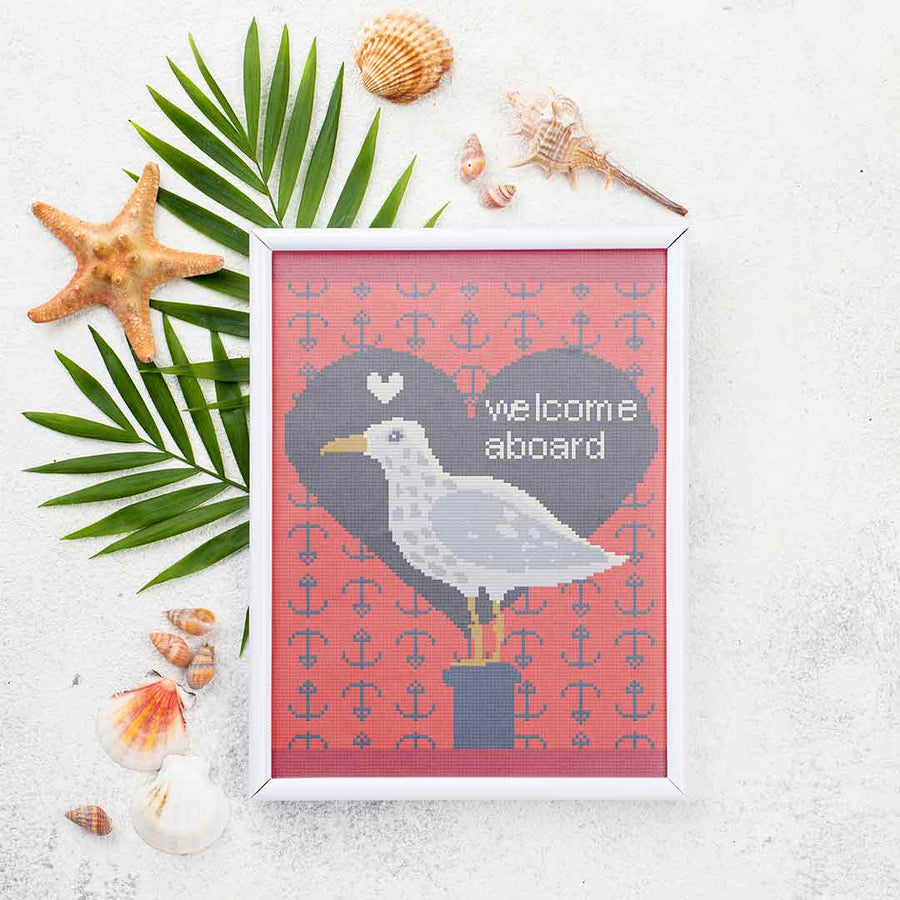 Stitched and framed preview of Welcome Aboard Counted Cross Stitch Pattern and Kit