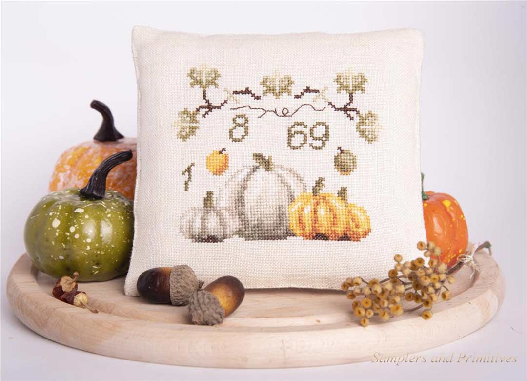 A stitched preview of the counted cross stitch pattern 1869 Thanksgiving Pincushion by Samplers and Primitives