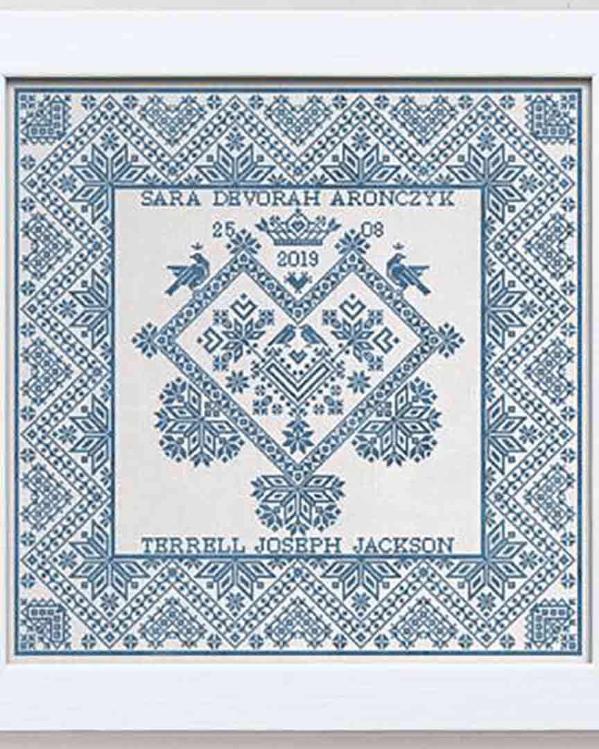A stitched preview of the counted cross stitch pattern A Crowned Heart: A Wedding Sampler by Modern Folk Embroidery