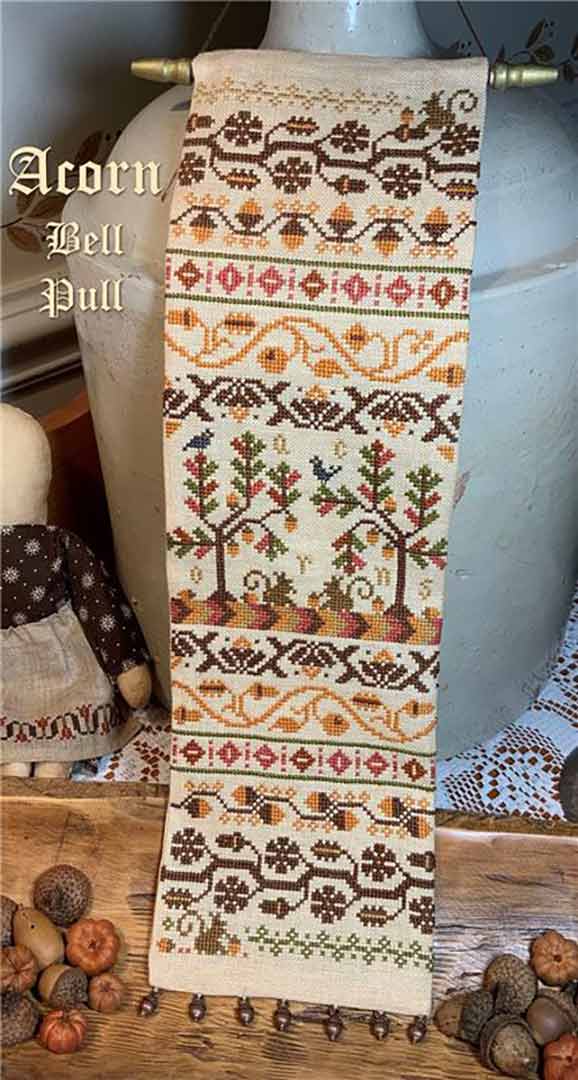 A stitched preview of the counted cross stitch pattern Acorn Bell Pull by The Calico Confectionery
