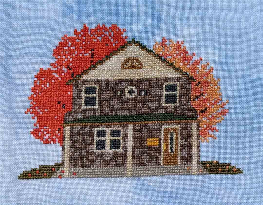 A stitched preview of the counted cross stitch pattern Autumn House by KEB Studio Creations