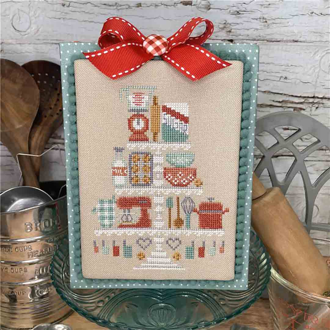 A stitched preview of the counted cross stitch pattern Baking Tier by Erin Elizabeth Designs