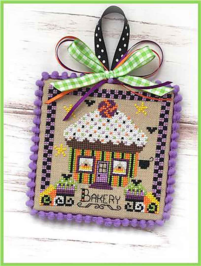 A stitched preview of the counted cross stitch pattern Booville Bakery by Sugar Stitches Design