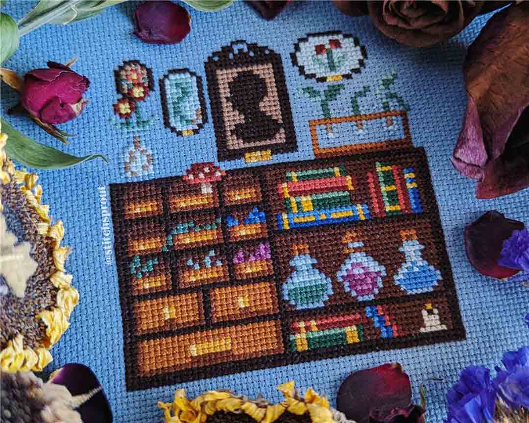 A stitched preview of the counted cross stitch pattern Cabinet Of Curiosities by StitchSprout
