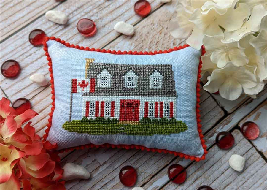 A stitched preview of the counted cross stitch pattern Canada House by KEB Studio Creations