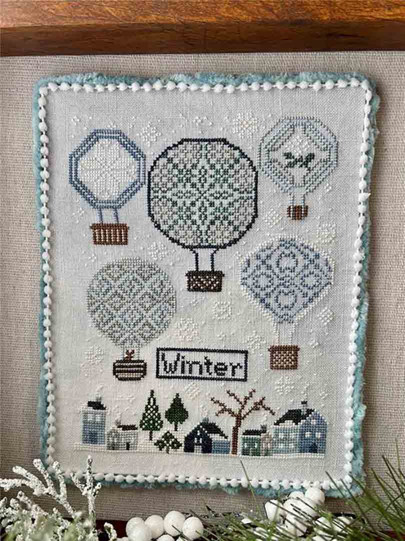 A stitched preview of the counted cross stitch pattern Carolyn's Balloons - Winter by Jan Hicks Creates