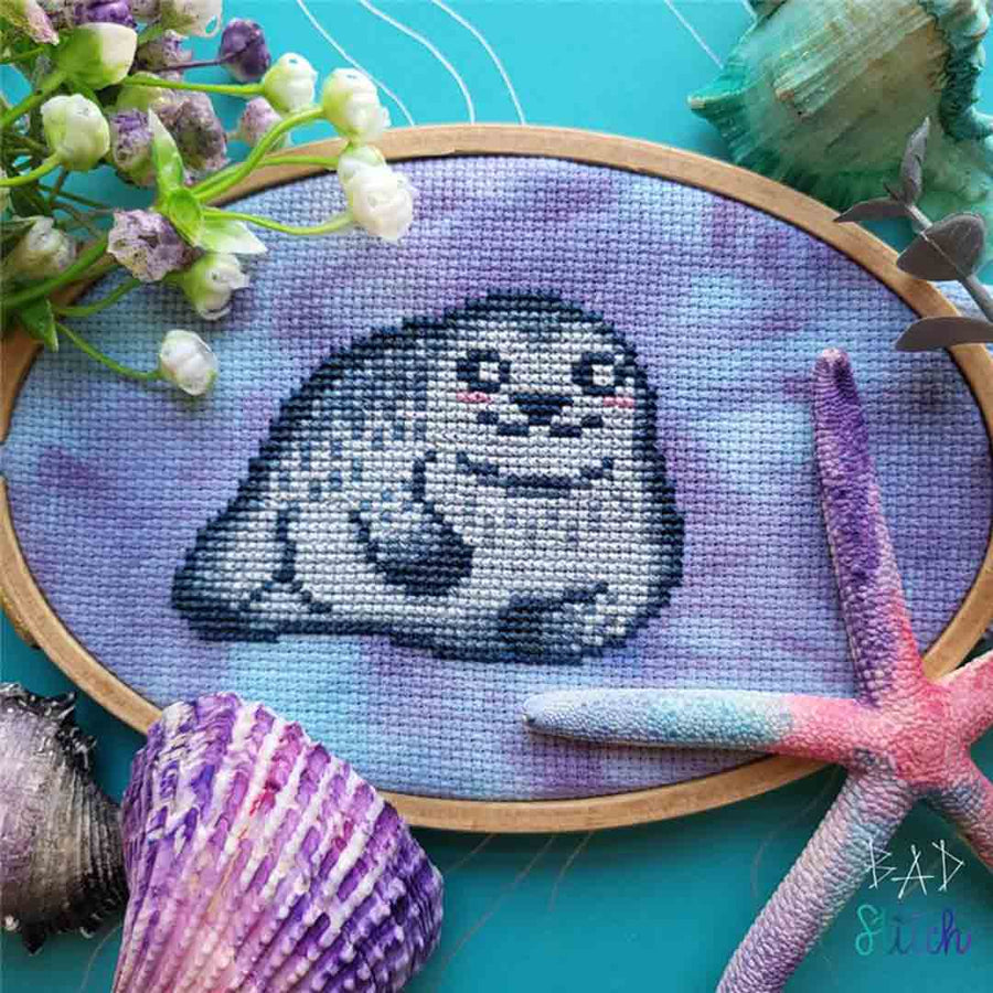 A stitched preview of the counted cross stitch pattern Chonky Seal by BAD Stitch