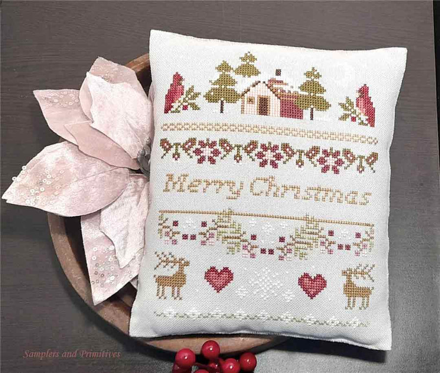 A stitched preview of the counted cross stitch pattern Christmas Band Sampler by Samplers and Primitives