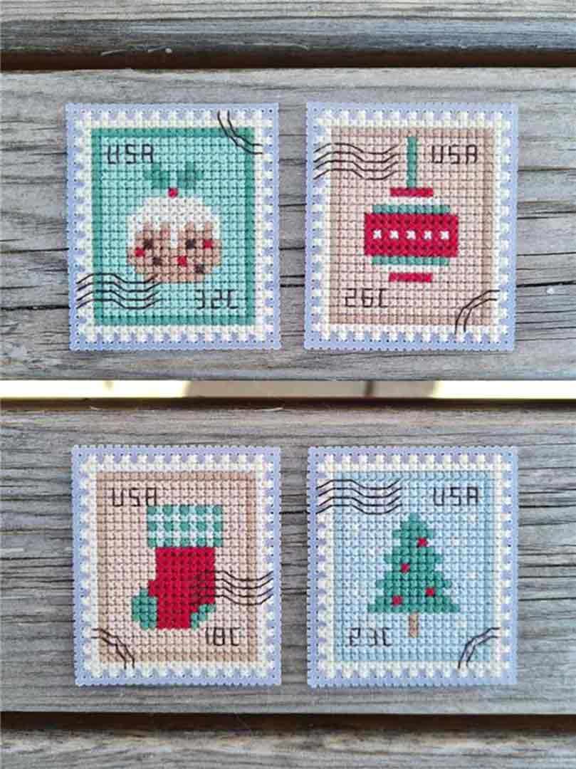 A stitched preview of the counted cross stitch pattern Christmas Postage Stamps by Kate Spiridonova