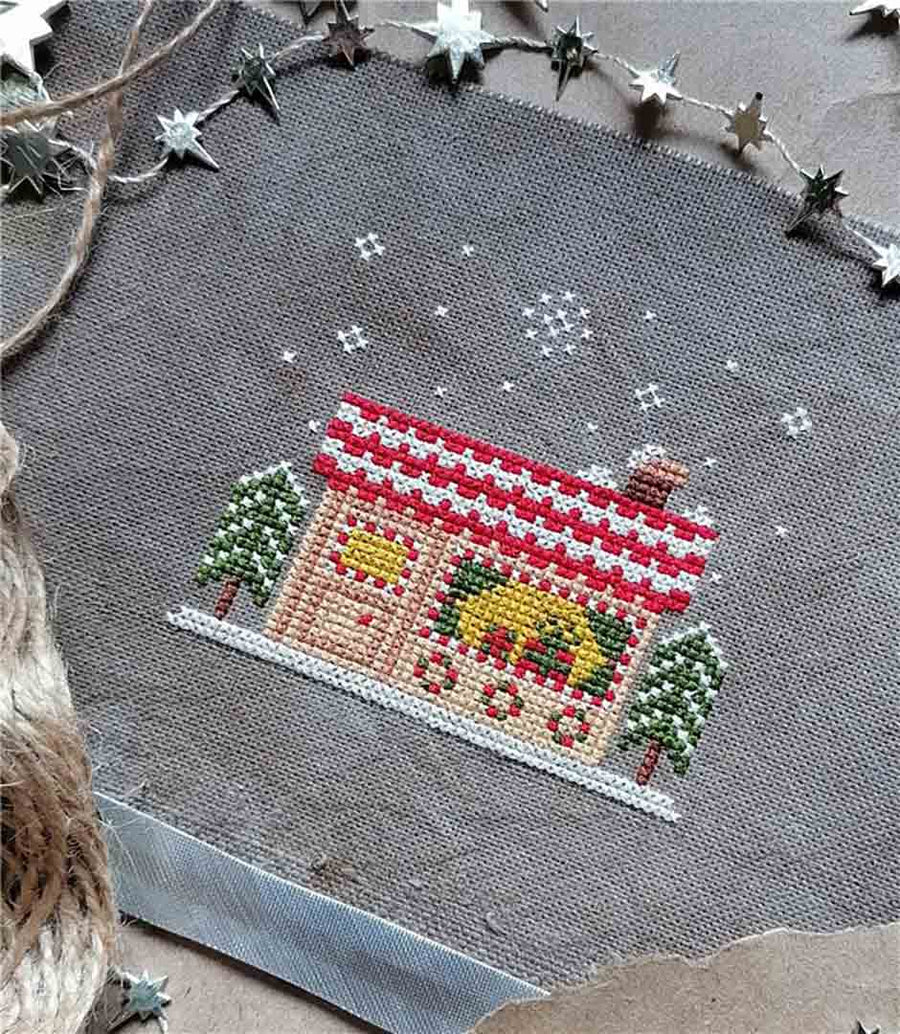 A stitched preview of the counted cross stitch pattern Christmas Shop by Kate Spiridonova