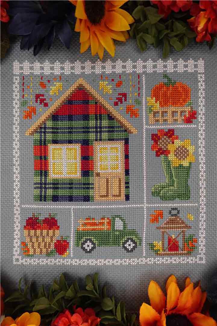 A stitched preview of the counted cross stitch pattern Fall Cabin by Erin Elizabeth Designs