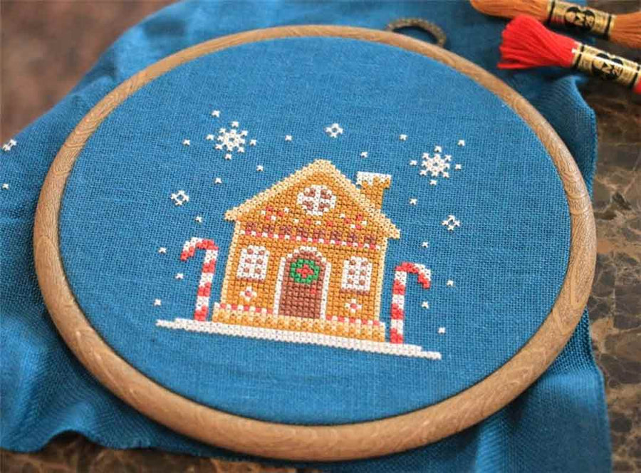 A stitched preview of the counted cross stitch pattern Gingerbread House by Kate Spiridonova