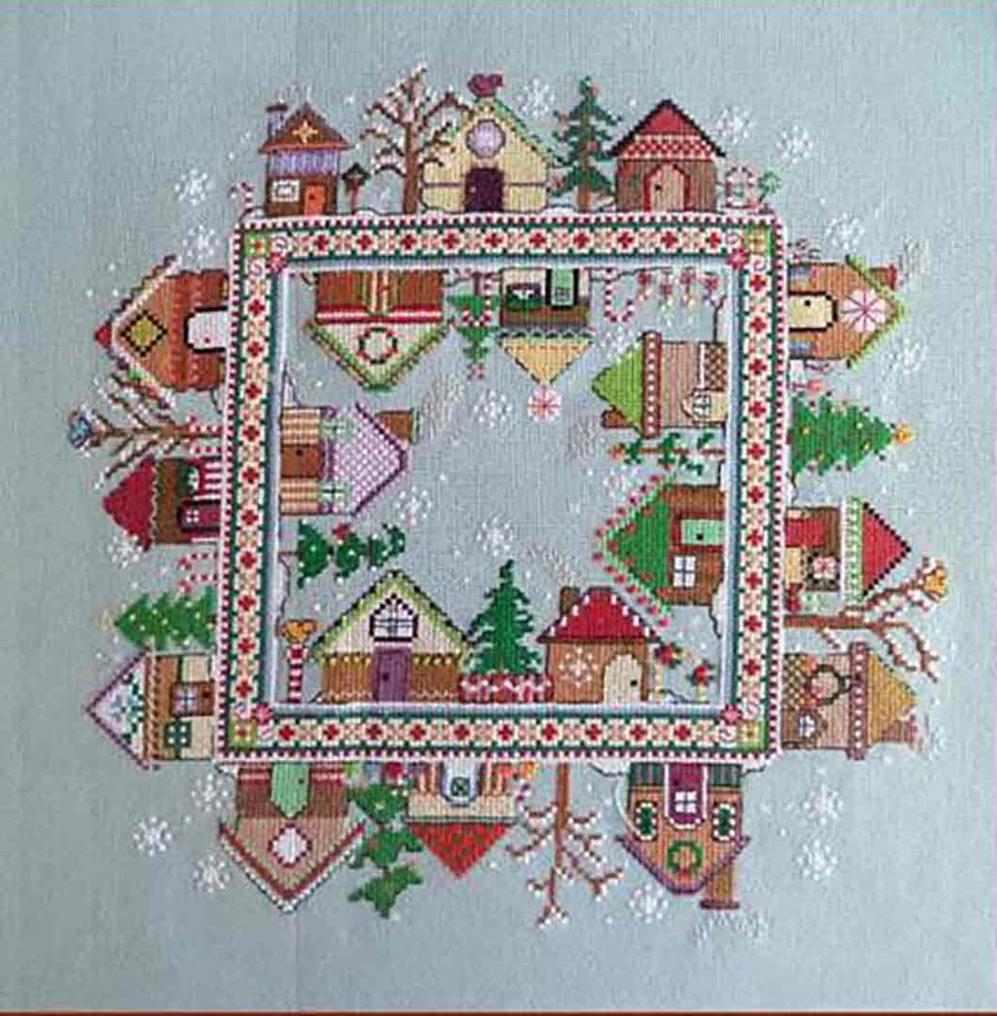 A stitched preview of the counted cross stitch pattern Gingerbread Village by Carolyn Manning Designs