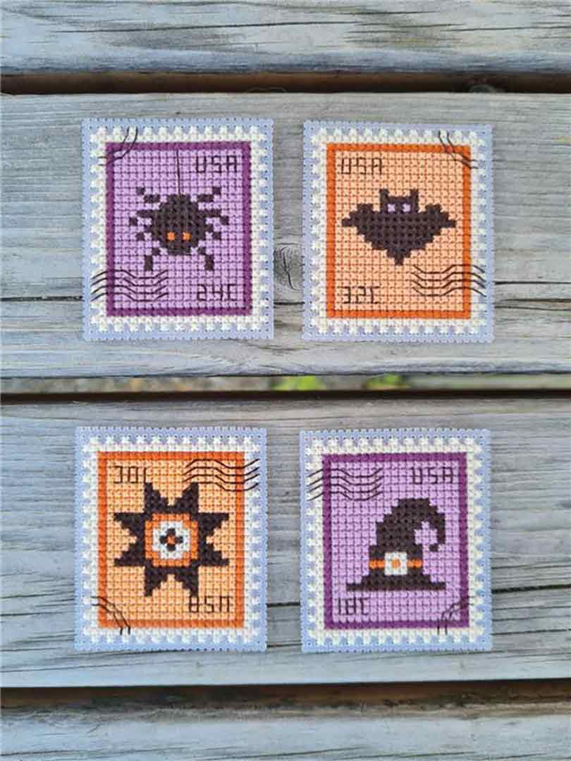 A stitched preview of the counted cross stitch pattern Halloween Postage Stamps by Kate Spiridonova