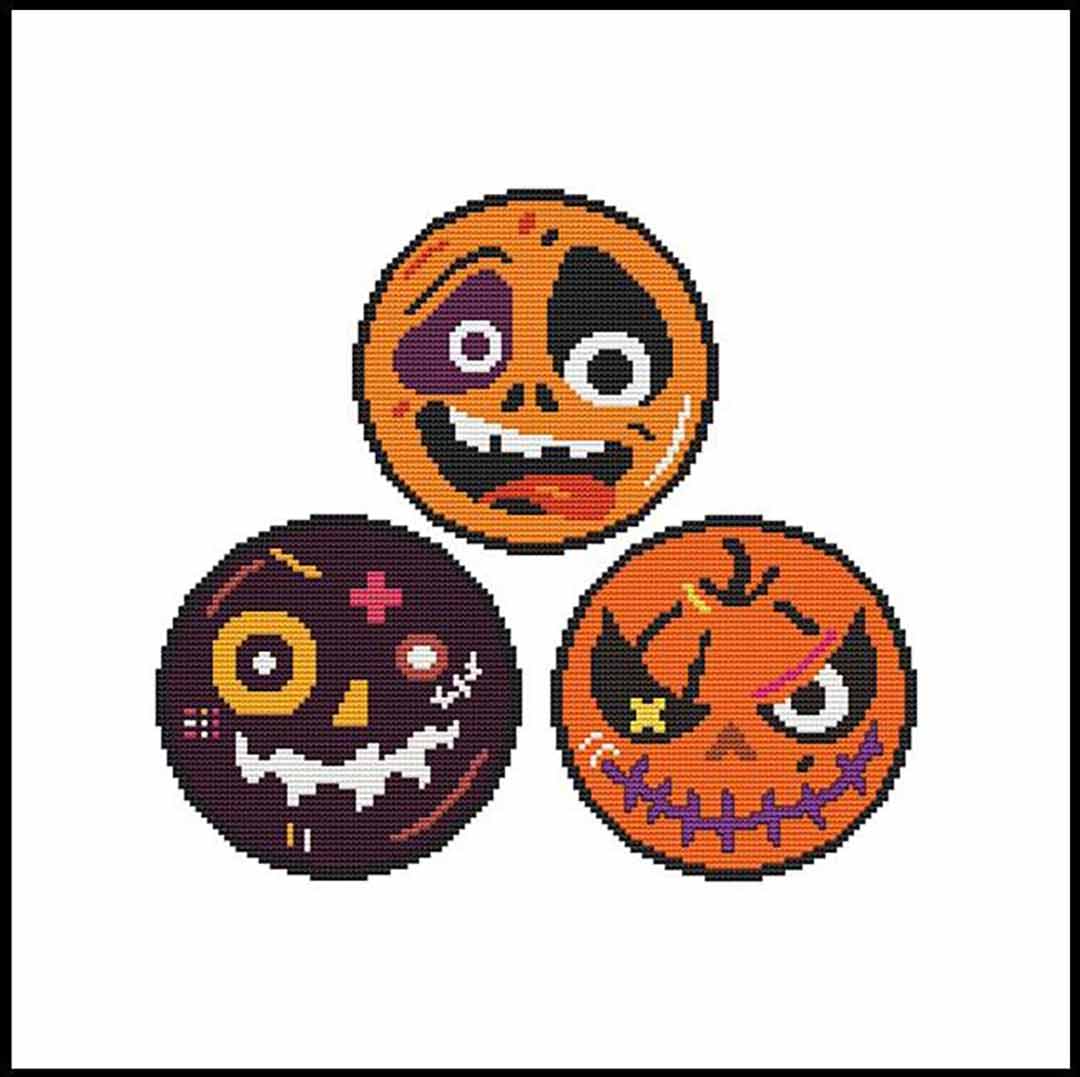 A stitched preview of the counted cross stitch pattern Halloween Round Faces Trio by Marcia Manning