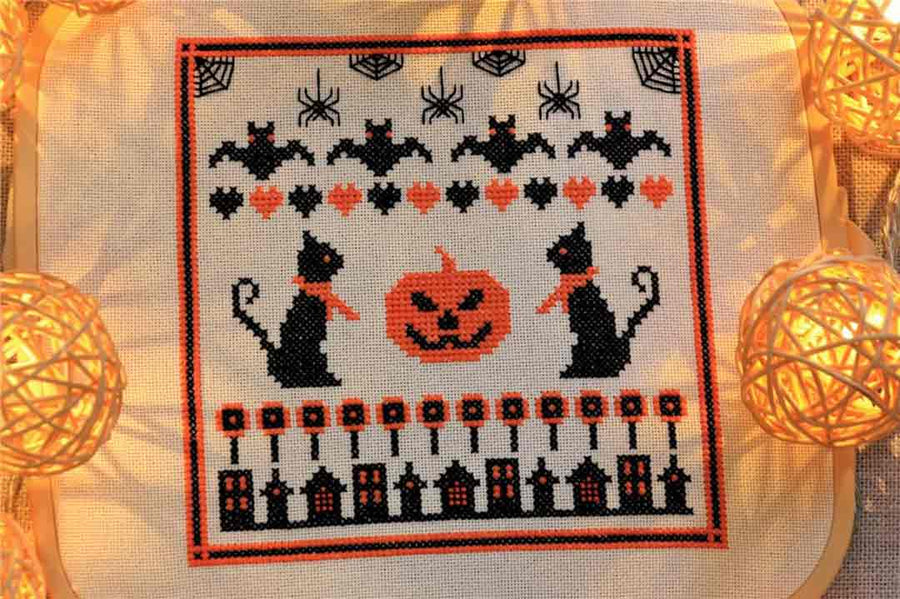 A stitched preview of the counted cross stitch pattern Halloween Sampler by Kate Spiridonova