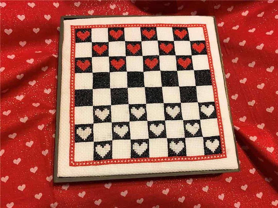 A stitched preview of the counted cross stitch pattern Heart Checkers by KEB Studio Creations