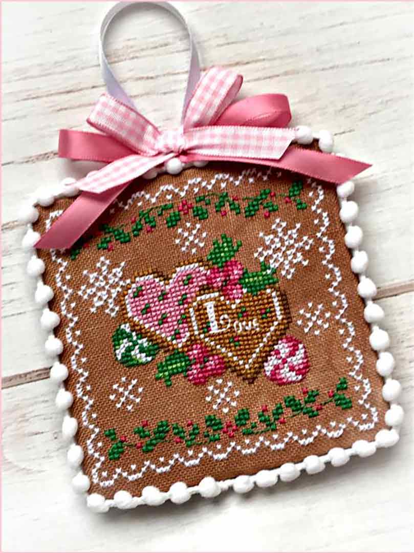 A stitched preview of the counted cross stitch pattern Holiday Sweethearts by Sugar Stitches Design