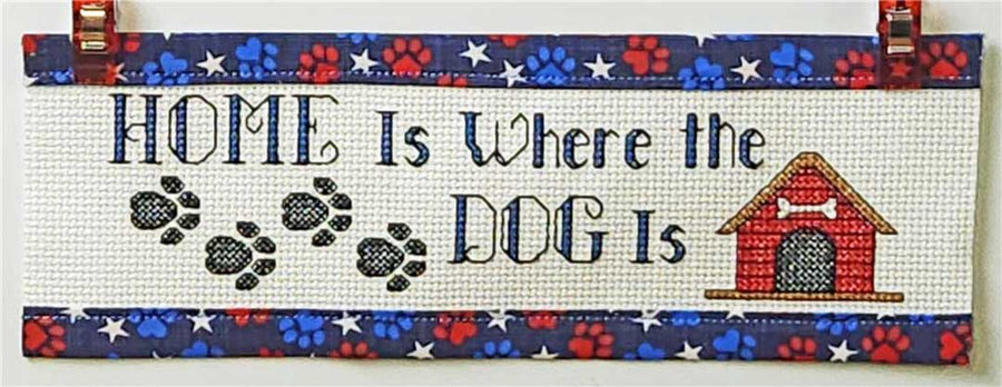 A stitched preview of the counted cross stitch pattern Home Is Where The Dog Is by Rogue Stitchery