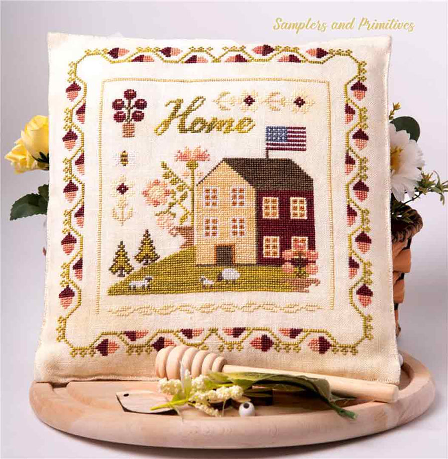 A stitched preview of the counted cross stitch pattern Home by Samplers and Primitives