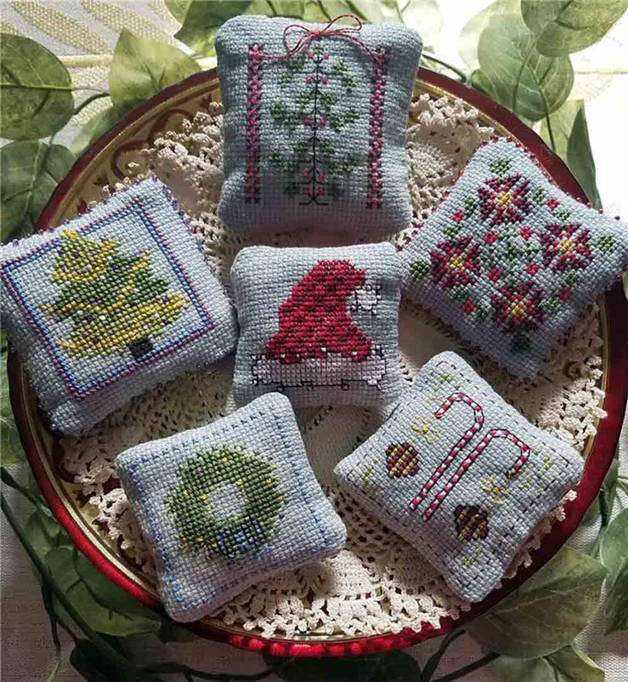 A stitched preview of the counted cross stitch pattern Lil Stitches - December Cross Stitch Smalls by Carolyn Manning Designs