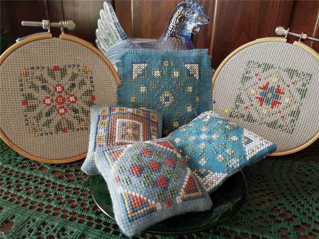 A stitched preview of the counted cross stitch pattern Lil Stitches - July Cross Stitch Smalls by Carolyn Manning Designs
