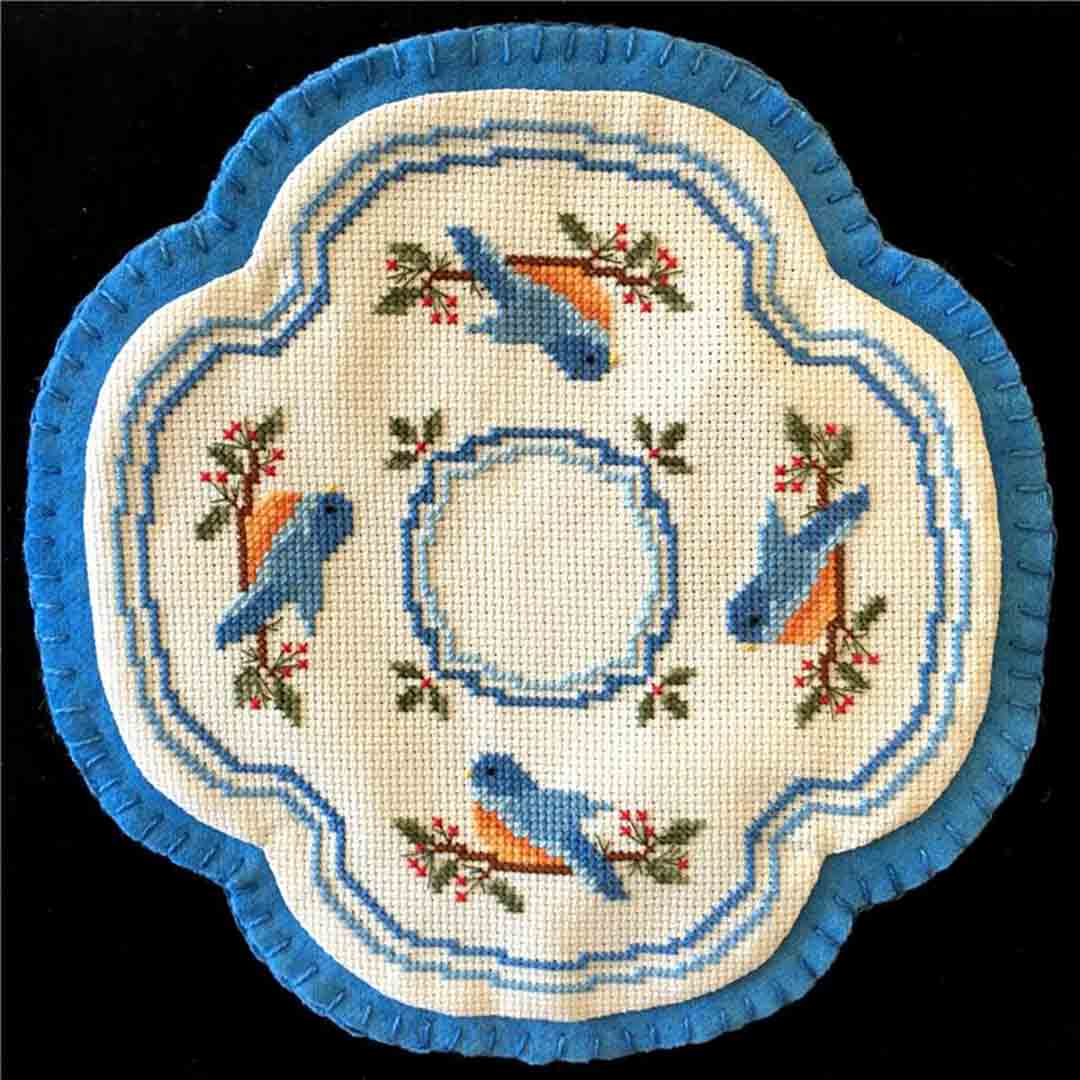 A stitched preview of the counted cross stitch pattern Little Candle Mats - Bluebirds by Prairie Grove Peddler