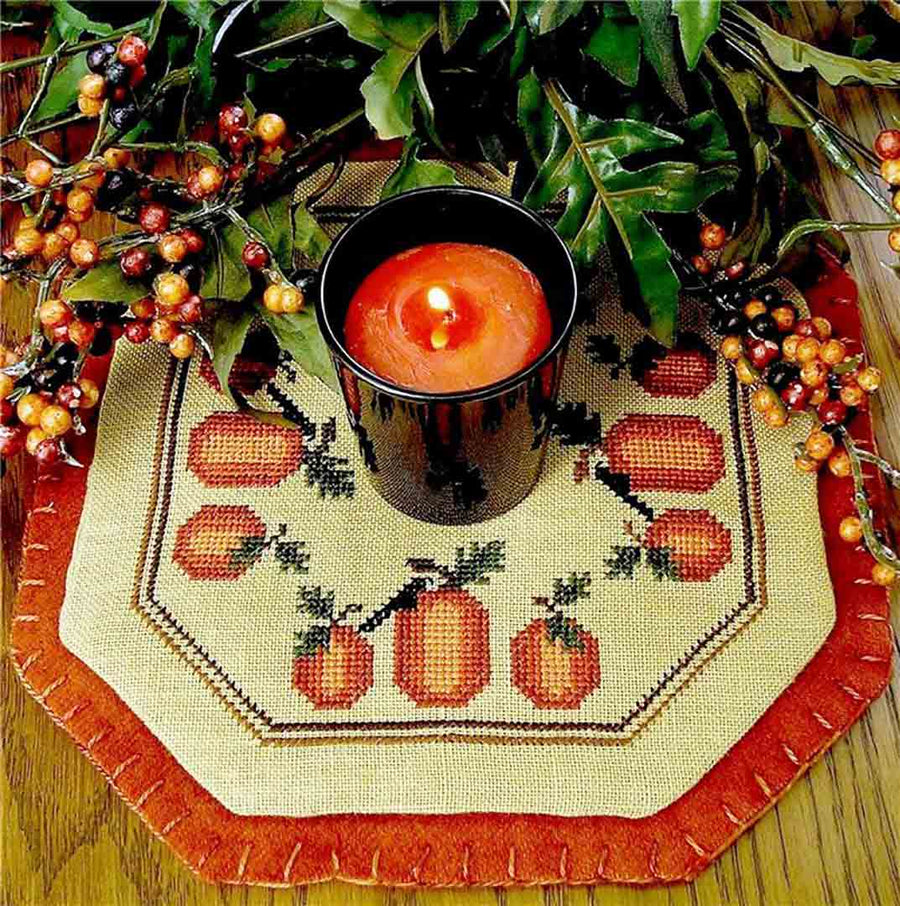 A stitched preview of the counted cross stitch pattern Little Candle Mats - Pumpkin Harvest by Prairie Grove Peddler