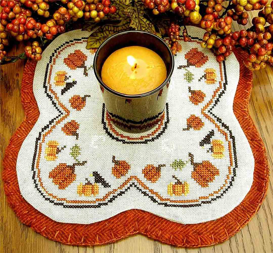 A stitched preview of the counted cross stitch pattern Little Candle Mats - Pumpkins by Prairie Grove Peddler