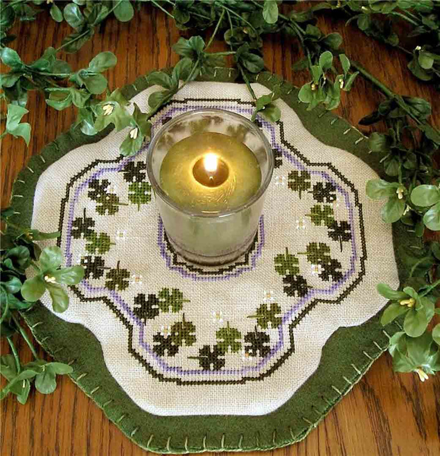 A stitched preview of the counted cross stitch pattern Little Candle Mats - Shamrocks by Prairie Grove Peddler