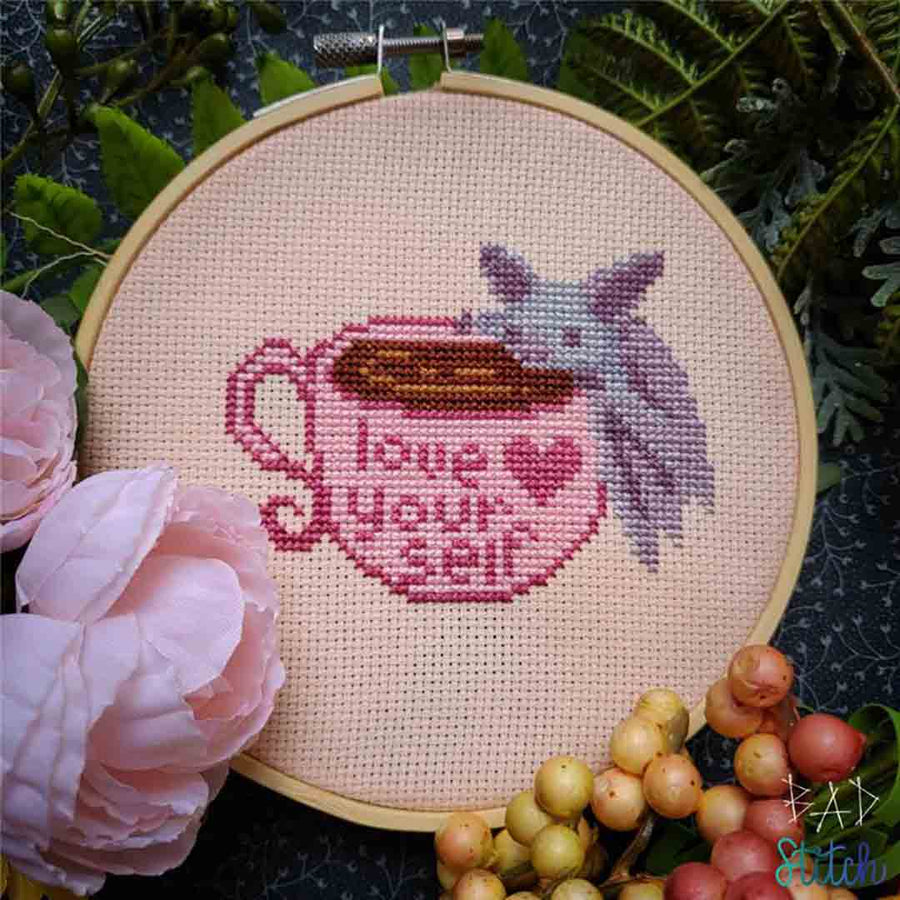 A stitched preview of the counted cross stitch pattern Love Yourself by BAD Stitch