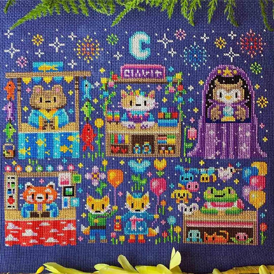 A stitched preview of the counted cross stitch pattern Night Market Magic by Flossy Fox Shop
