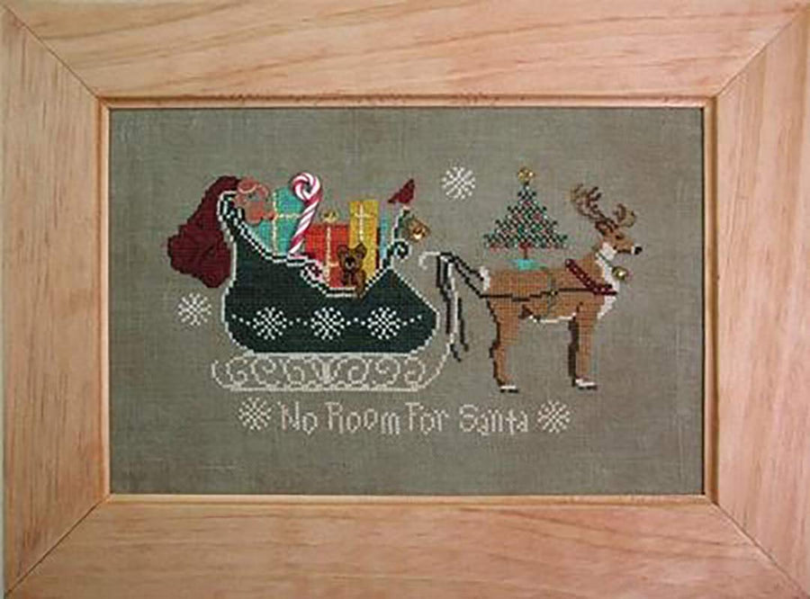 A stitched preview of the counted cross stitch pattern No Room For Santa by Janis Lockhart