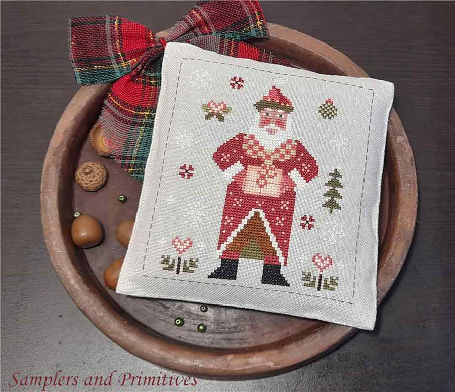 A stitched preview of the counted cross stitch pattern Patchwork Santa by Samplers and Primitives