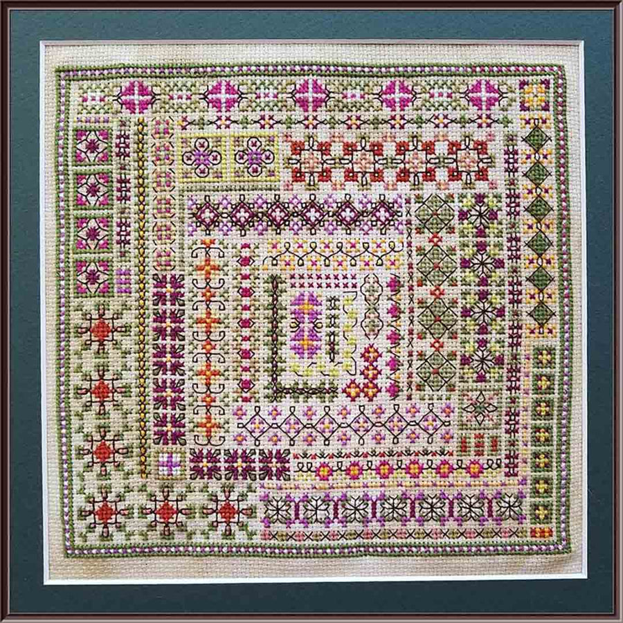 A stitched preview of the counted cross stitch pattern Petal & Vine by Carolyn Manning Designs
