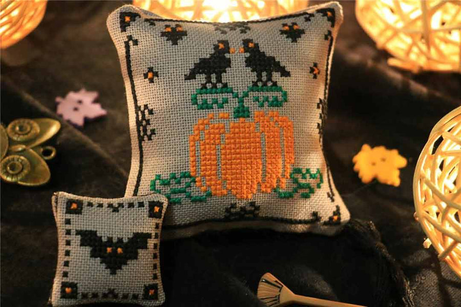 A stitched preview of the counted cross stitch pattern Pumpkin And Bat by Kate Spiridonova