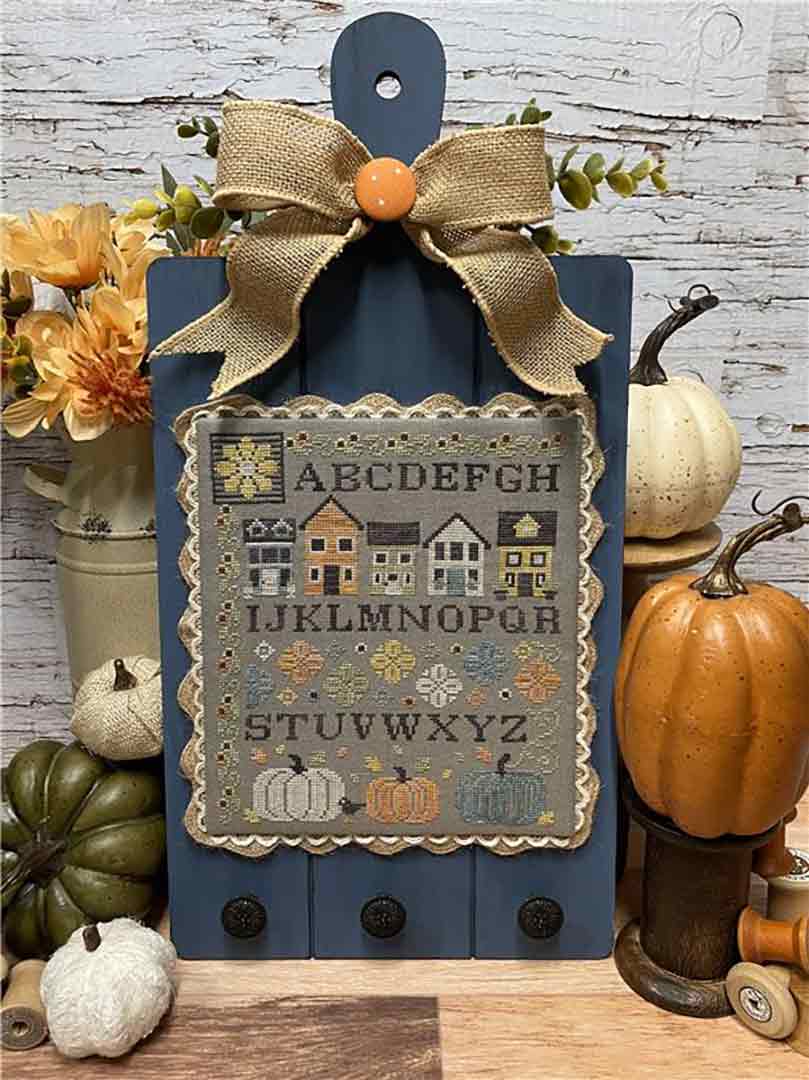 A stitched preview of the counted cross stitch pattern Pumpkin Lane Sampler by Erin Elizabeth Designs