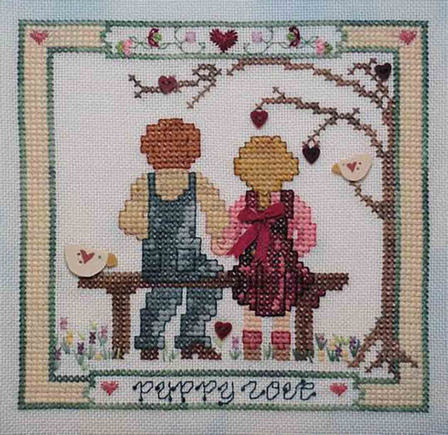 A stitched preview of the counted cross stitch pattern Puppy Love by Janis Lockhart
