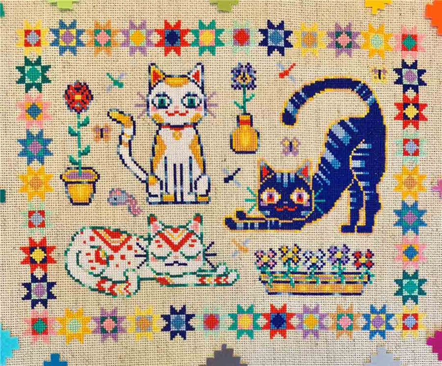 A stitched preview of the counted cross stitch pattern Quilted Cats by Flossy Fox Shop