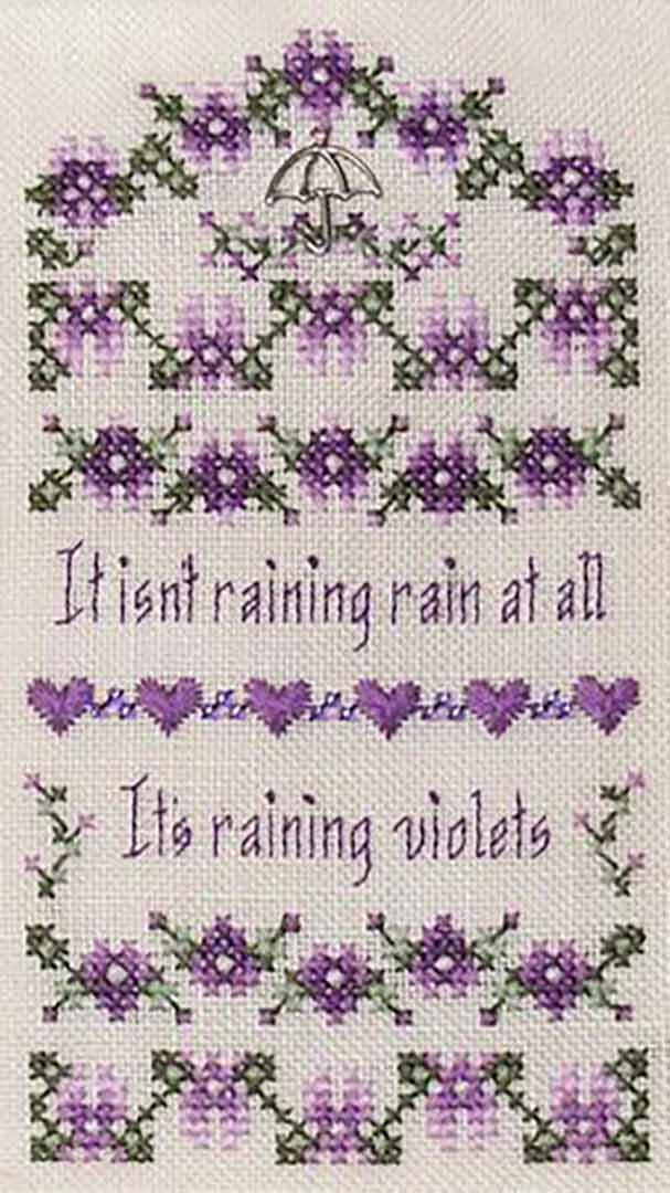 A stitched preview of the counted cross stitch pattern Raining Violets by Janis Lockhart