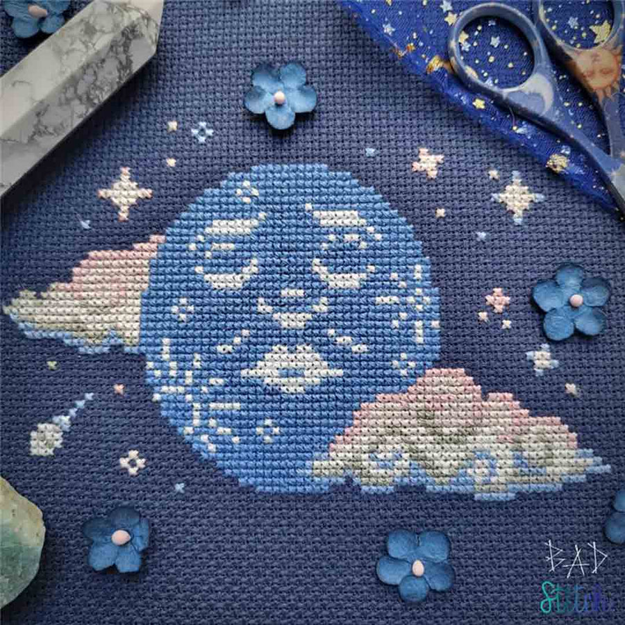 A stitched preview of the counted cross stitch pattern Resting Moon Face by BAD Stitch